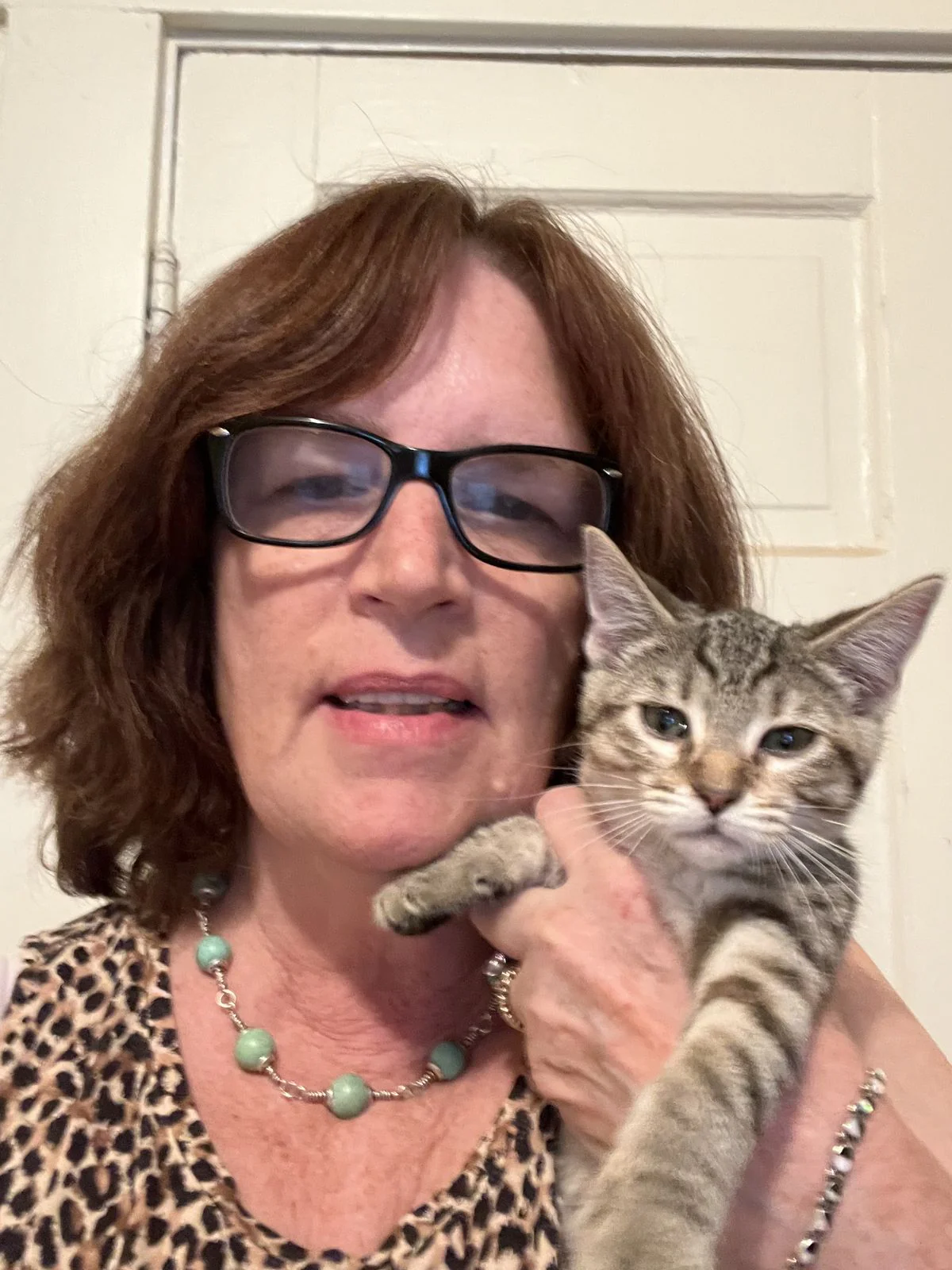 Happy pet owner with her cat